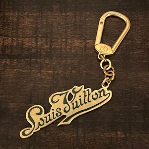 Authentic Louis Vuitton Legende purse charm